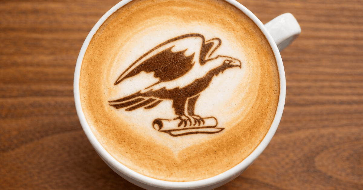 A Freshly made latte with our campus logo